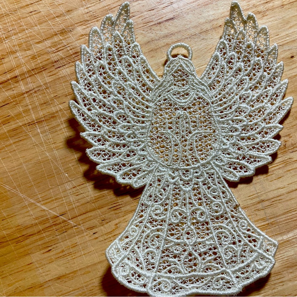 Machine Embroidered Angel Christmas. Ornament.  4 1/2”h x 3 1/2”w. C: Off White